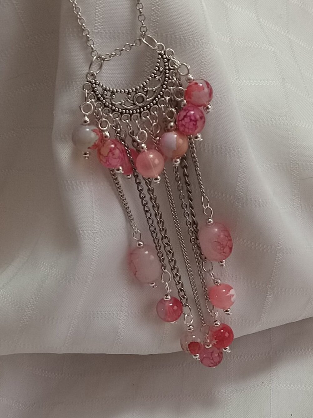 Exquisite handmade necklace featuring a half-moon-shaped Tibetan silver charm